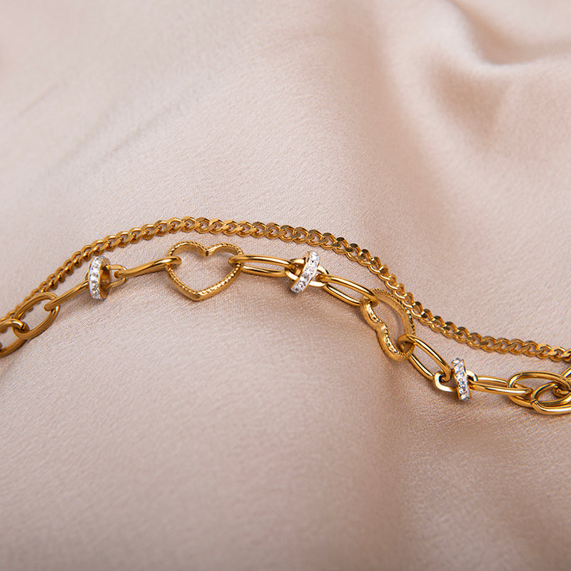 amberz gouden armband met hartje en zirkonia steentjes, verstelbare schakelarmband, stainless steel sieraden