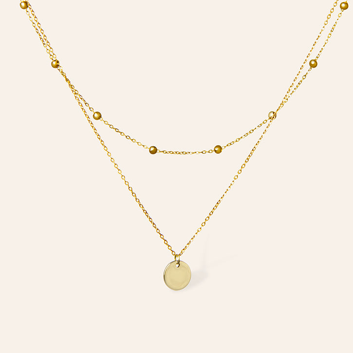 Gouden gelaagde ketting met munt hanger en bolletjes ketting – Bloem van Amberz, waterproof en hypoallergeen.