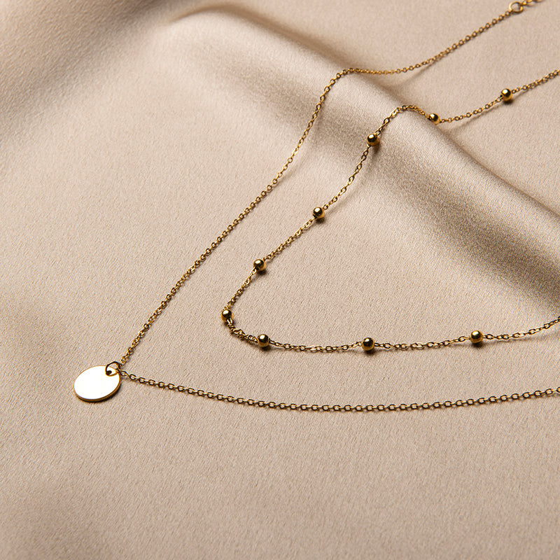 Gouden gelaagde ketting met munt hanger en bolletjes ketting – Bloem van Amberz, waterproof en hypoallergeen.