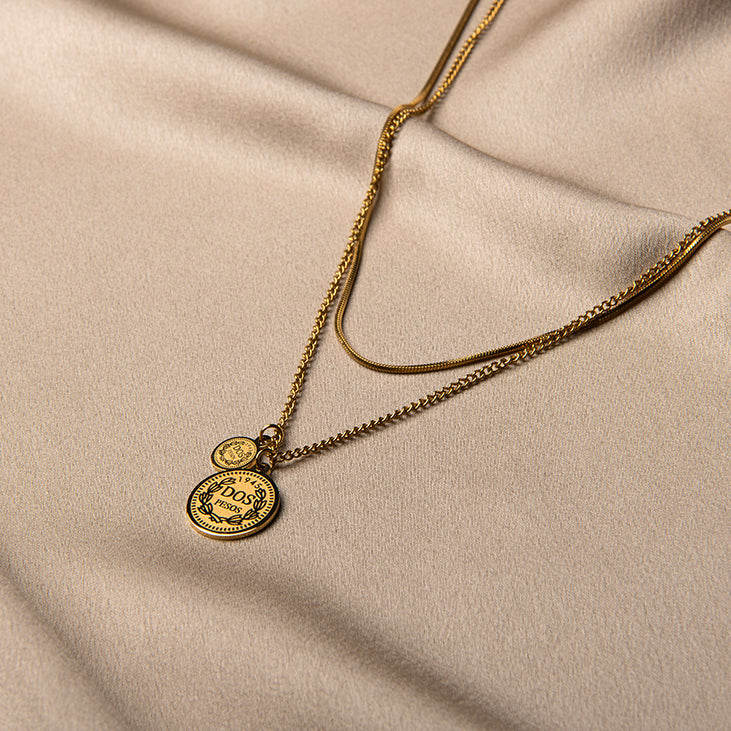 Gouden ketting met muntjes in laagjes – Palawan van Amberz.