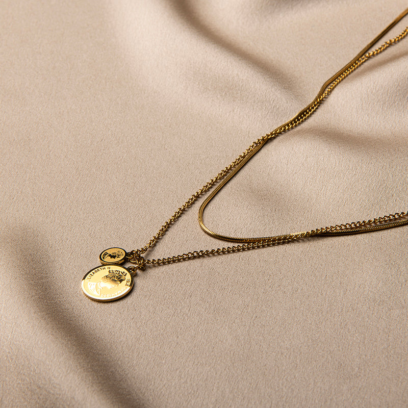 Gouden ketting met muntjes in laagjes – Palawan van Amberz.