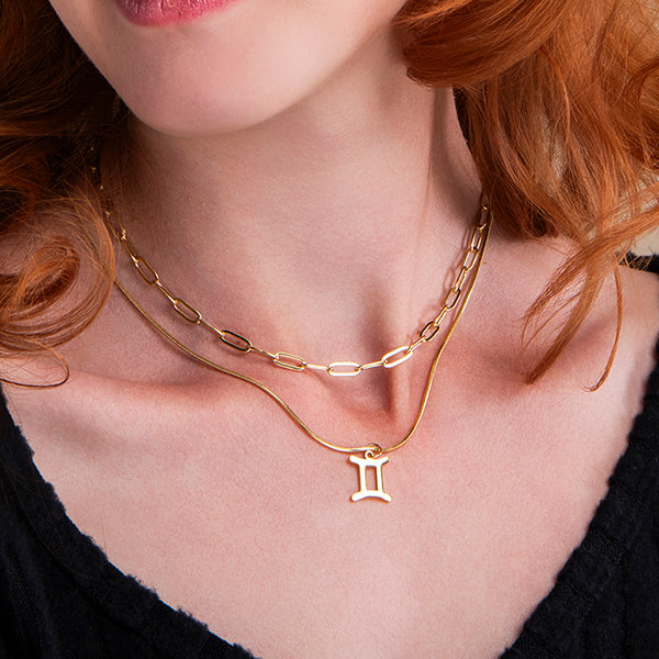 gouden dubbele ketting met sterrenbeeld hanger tweelingen – zodiac ketting met paperclip en slangenketting